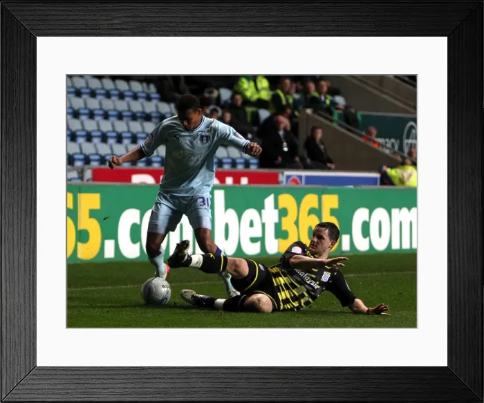 Framed Print : Clash at Ricoh Arena: Cyrus Christie vs Craig Conway - A Football Rivalry Unfolds Framed Print : Clash at Ricoh Arena: Cyrus Christie vs Craig Conway - A Football Rivalry Unfolds