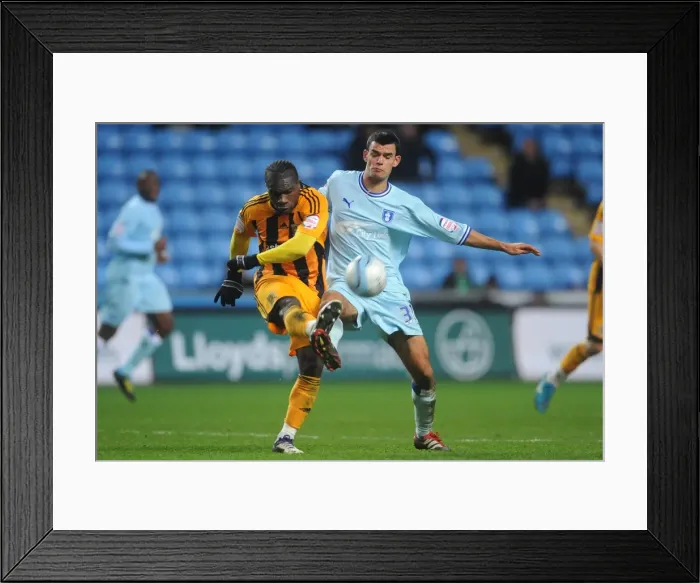 Framed Print : Conor Thomas vs. Aaron McLean: Intense Clash in Coventry City vs. Hull City, Npower Championship (10-12-2011, Ricoh Arena)