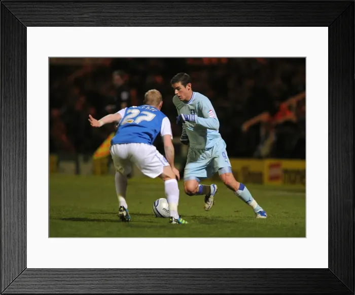 Framed Print : Battle for the Ball: Jutkiewicz vs Alcock in Coventry City's Championship Showdown with Peterborough United (December 17, 2011) Framed Print : Battle for the Ball: Jutkiewicz vs Alcock in Coventry City's Championship Showdown with Peterborough United (December 17, 2011)