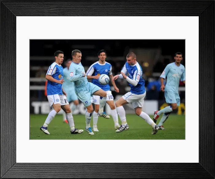 Framed Print : Clash at London Road: McSheffrey vs. Tunnicliffe in Intense Coventry City vs. Peterborough United Npower Championship Showdown Framed Print : Clash at London Road: McSheffrey vs. Tunnicliffe in Intense Coventry City vs. Peterborough United Npower Championship Showdown