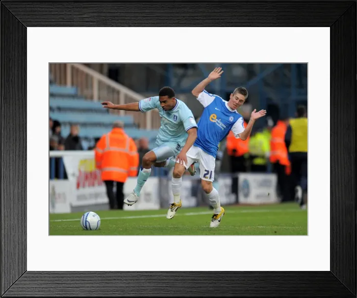 Framed Print : Clash of the Titans: Cyrus Christie vs Daniel Kearns, Coventry City vs Peterborough United (Npower Championship, 17-12-2011, London Road) Framed Print : Clash of the Titans: Cyrus Christie vs Daniel Kearns, Coventry City vs Peterborough United (Npower Championship, 17-12-2011, London Road)