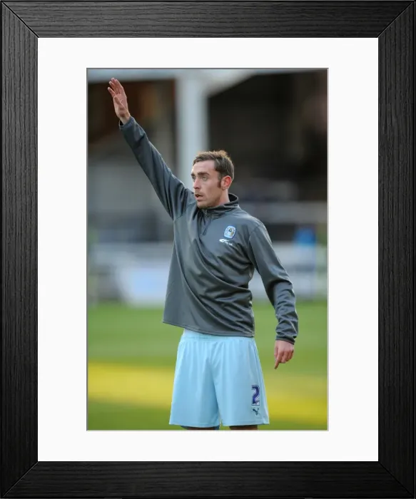Framed Print : Richard Keogh Leads Coventry City in Npower Championship Battle against Peterborough United (17-12-2011)