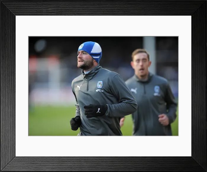 Framed Print : James McPake Faces Off Against Peterborough United in Coventry City's Championship Clash at London Road (17-12-2011) Framed Print : James McPake Faces Off Against Peterborough United in Coventry City's Championship Clash at London Road (17-12-2011)
