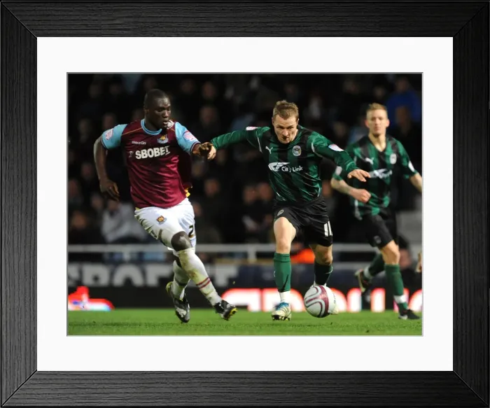 Framed Print : Diop vs McSheffrey: A Championship Showdown at Upton Park (West Ham United vs Coventry City, 2012) Framed Print : Diop vs McSheffrey: A Championship Showdown at Upton Park (West Ham United vs Coventry City, 2012)