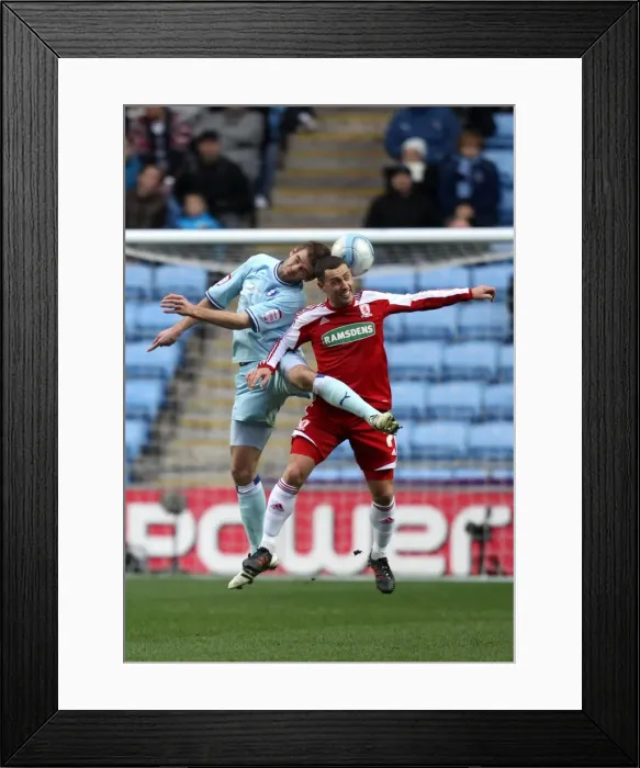Framed Print : Intense Rivalry: Coventry City vs. Middlesbrough - Cranie vs. McDonald's Battle for the Ball (Npower Championship, 21-01-2012) Framed Print : Intense Rivalry: Coventry City vs. Middlesbrough - Cranie vs. McDonald's Battle for the Ball (Npower Championship, 21-01-2012)