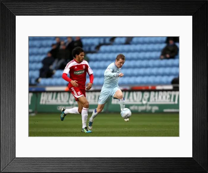 Framed Print : Intense Rivalry: McSheffrey vs. Haroun Battle for Ball Supremacy (Coventry City vs. Middlesbrough, Npower Championship, 21-01-2012) Framed Print : Intense Rivalry: McSheffrey vs. Haroun Battle for Ball Supremacy (Coventry City vs. Middlesbrough, Npower Championship, 21-01-2012)