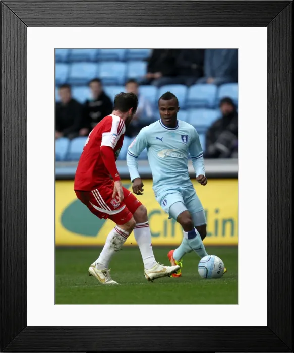 Framed Print : Battle for the Ball: Coventry City vs. Middlesbrough - A Clash Between Alex Nimely and Matthew Bates (Npower Championship, 21-01-2012) Framed Print : Battle for the Ball: Coventry City vs. Middlesbrough - A Clash Between Alex Nimely and Matthew Bates (Npower Championship, 21-01-2012)