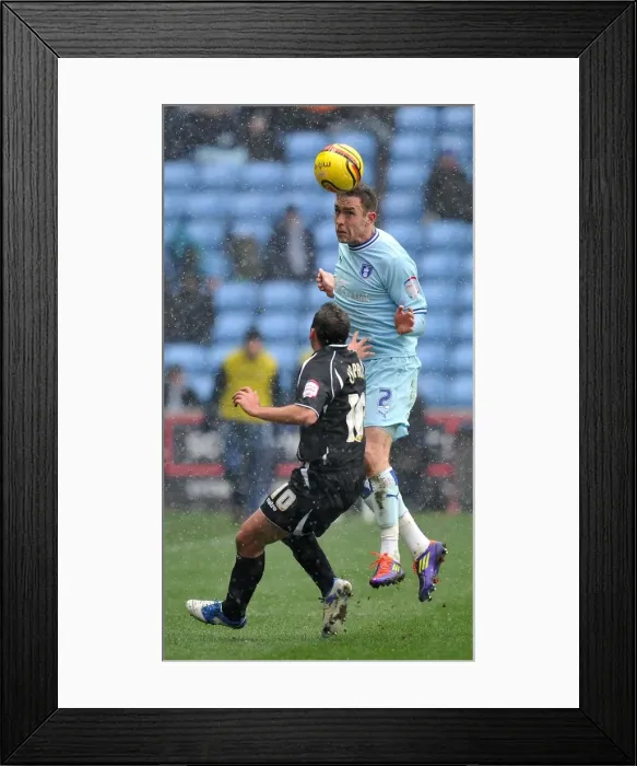 Framed Print : Keogh Soars Over Chopra: Coventry City vs Ipswich Town Championship Showdown at Ricoh Arena Framed Print : Keogh Soars Over Chopra: Coventry City vs Ipswich Town Championship Showdown at Ricoh Arena