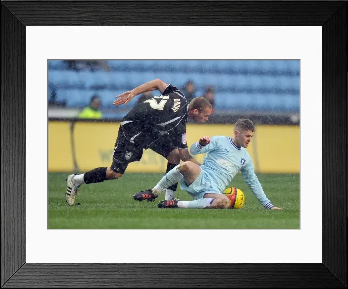 Framed Print : Battle for the Ball: Norwood vs. Drury in Coventry City vs. Ipswich Town Championship Clash Framed Print : Battle for the Ball: Norwood vs. Drury in Coventry City vs. Ipswich Town Championship Clash