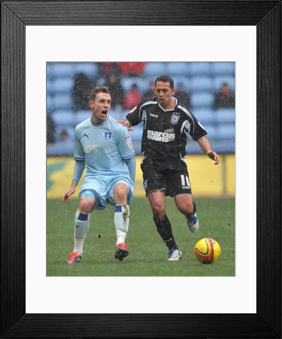 Framed Print : Intense Rivalry: Keogh vs. Chopra Clash in Coventry City vs. Ipswich Town Npower Championship Match (04-02-2012) Framed Print : Intense Rivalry: Keogh vs. Chopra Clash in Coventry City vs. Ipswich Town Npower Championship Match (04-02-2012)