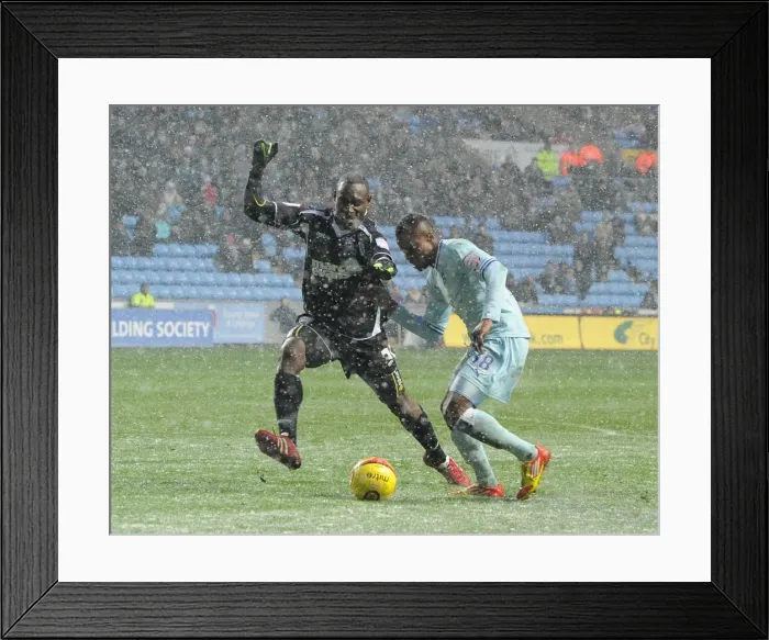 Framed Print : Battle for the Ball: Nimely vs. Sonko - Coventry City vs. Ipswich Town Championship Showdown (04-02-2012, Ricoh Arena) Framed Print : Battle for the Ball: Nimely vs. Sonko - Coventry City vs. Ipswich Town Championship Showdown (04-02-2012, Ricoh Arena)