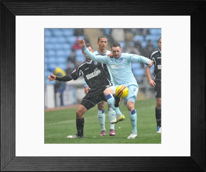 Framed Print : Intense Rivalry: David Bell vs Daryl Murphy Battle for Ball Supremacy in Coventry City vs Ipswich Town Npower Championship Clash (04-02-2012, Ricoh Arena) Framed Print : Intense Rivalry: David Bell vs Daryl Murphy Battle for Ball Supremacy in Coventry City vs Ipswich Town Npower Championship Clash (04-02-2012, Ricoh Arena)