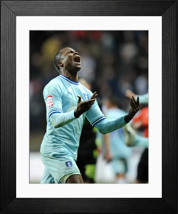 Framed Print : Coventry City's Alex Nimely: Champion Celebration after Victory over Leeds United (February 14, 2012) Framed Print : Coventry City's Alex Nimely: Champion Celebration after Victory over Leeds United (February 14, 2012)