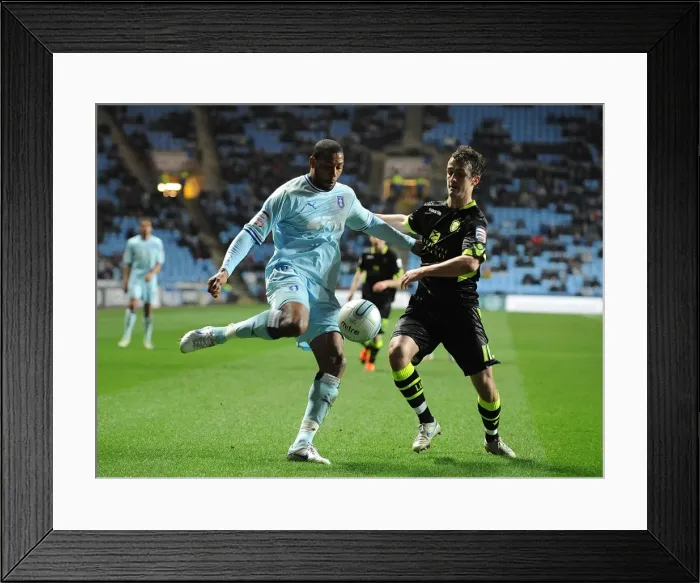Framed Print : Battleground Ricoh Arena: Coventry City vs. Leeds United - Clive Platt and Danny Pugh's Intense Battle for Control (Npower Championship, 14-02-2012) Framed Print : Battleground Ricoh Arena: Coventry City vs. Leeds United - Clive Platt and Danny Pugh's Intense Battle for Control (Npower Championship, 14-02-2012)
