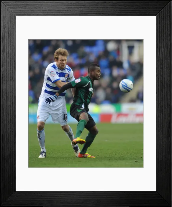 Framed Print : Battle for the Ball: Gorkss vs. Nimely in Coventry City vs. Reading Championship Clash (11-02-2012, Madejski Stadium) Framed Print : Battle for the Ball: Gorkss vs. Nimely in Coventry City vs. Reading Championship Clash (11-02-2012, Madejski Stadium)