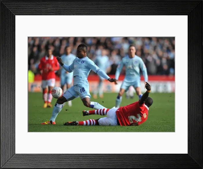 Framed Print : Battle for the Ball: Elokobi vs. Nimely - Nottingham Forest vs. Coventry City Championship Clash (February 18, 2012, City Ground) Framed Print : Battle for the Ball: Elokobi vs. Nimely - Nottingham Forest vs. Coventry City Championship Clash (February 18, 2012, City Ground)