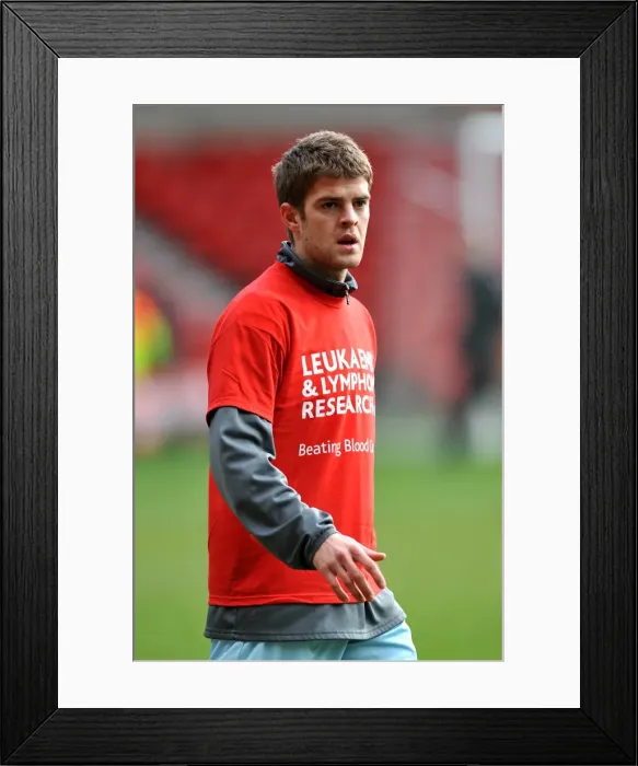Framed Print : Martin Cranie vs. Nottingham Forest: A Fierce Facing-Off Moment in the Npower Championship (18-02-2012)