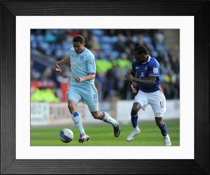 Framed Print : Battle at The King Power Stadium: Lloyd Dyer vs Cyrus Christie - Npower Championship Clash (03-03-2012) Framed Print : Battle at The King Power Stadium: Lloyd Dyer vs Cyrus Christie - Npower Championship Clash (03-03-2012)