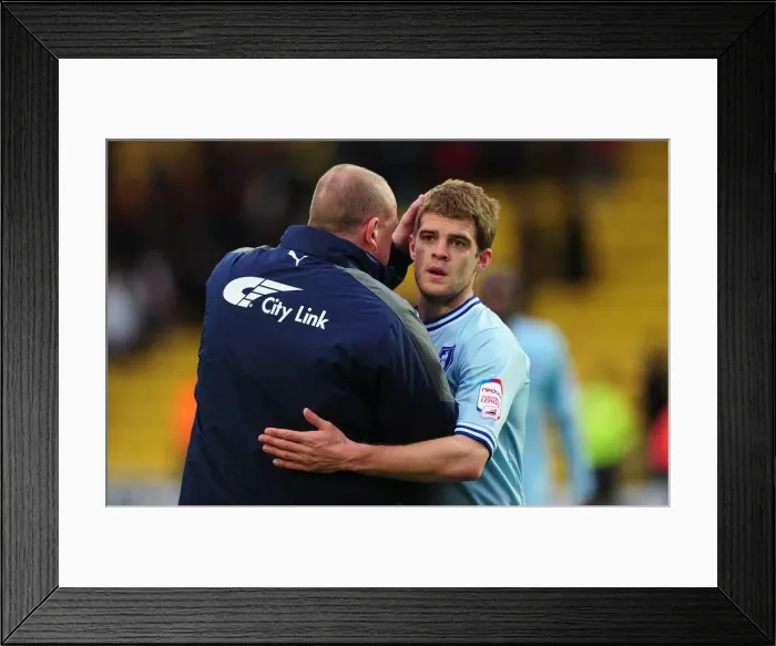 Framed Print : Andy Thorn and Martin Cranie: Coventry City's Jubilant Moment after Securing Victory over Watford (17-03-2012)