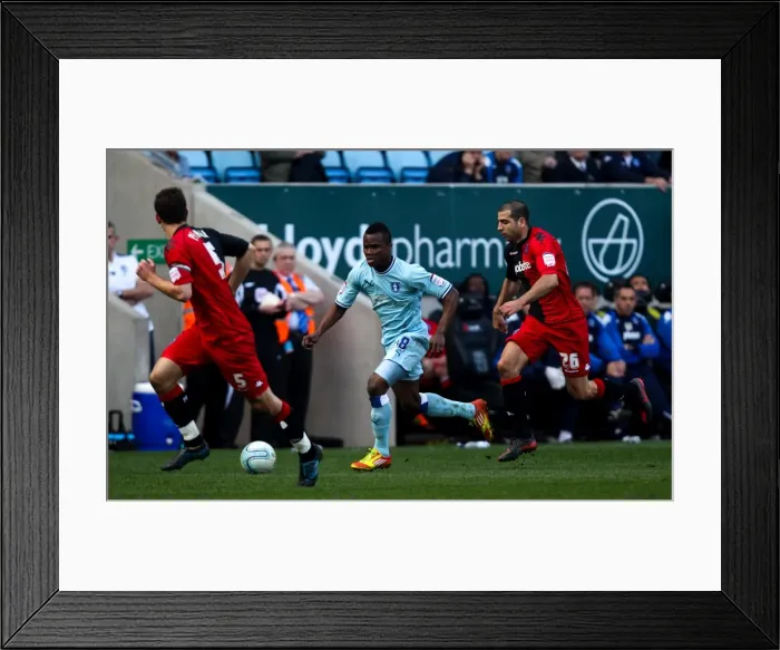 Framed Print : Intense Rivalry: Nimely Chases Down Pearce and Ben Haim, Coventry City vs Portsmouth (24-03-2012) Framed Print : Intense Rivalry: Nimely Chases Down Pearce and Ben Haim, Coventry City vs Portsmouth (24-03-2012)