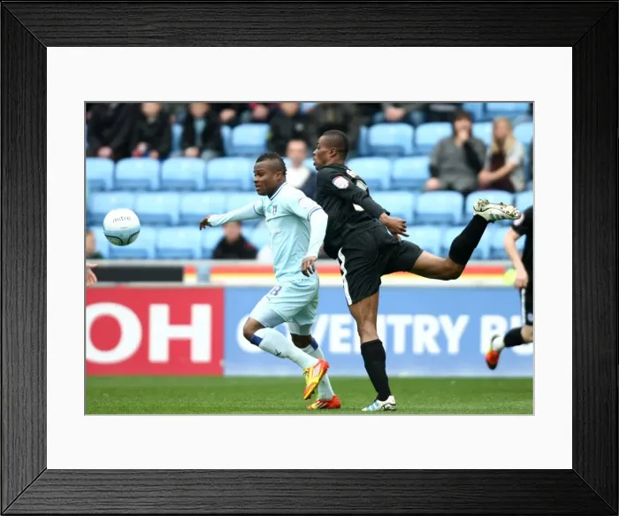 Framed Print : Clash of Titans: Nimely vs. Zakuani in Coventry City vs. Peterborough United Championship Showdown at Ricoh Arena Framed Print : Clash of Titans: Nimely vs. Zakuani in Coventry City vs. Peterborough United Championship Showdown at Ricoh Arena