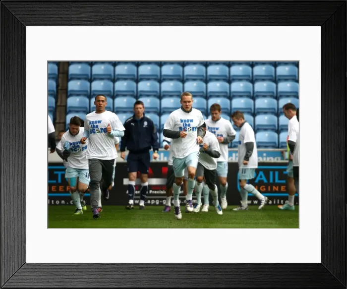 Framed Print : Coventry City Players Warm Up in Know the Score T-Shirts before Npower Championship Match