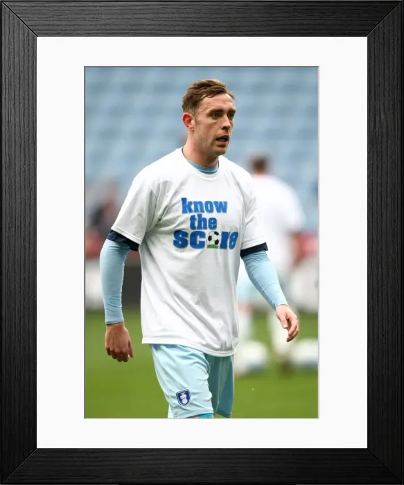 Framed Print : Richard Keogh's Pre-Match Routine: Gearing Up with Know the Score T-Shirt vs. Peterborough United (Npower Championship, 07-04-2012)