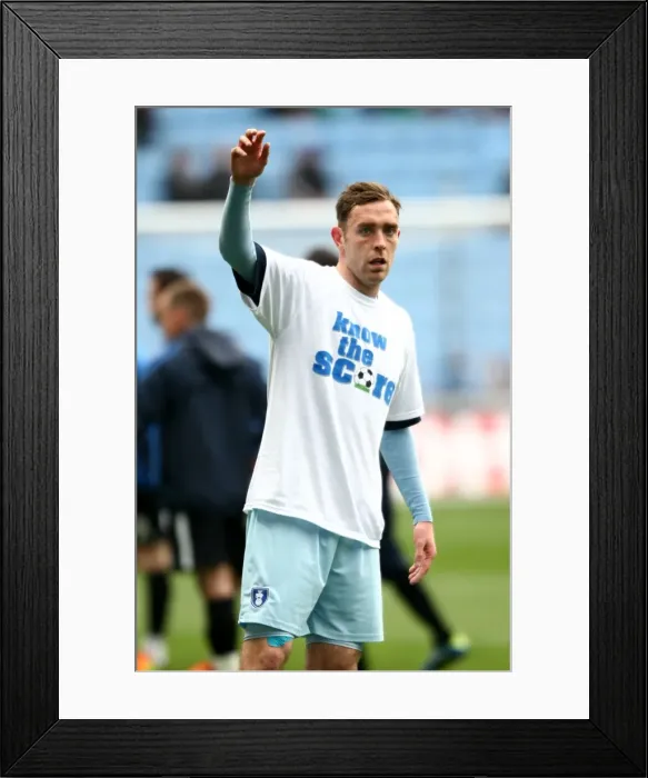 Framed Print : Richard Keogh's Pre-Match Warm-Up with Know the Score T-Shirt (Coventry City vs. Peterborough United, Npower Championship, 07-04-2012, Ricoh Arena)