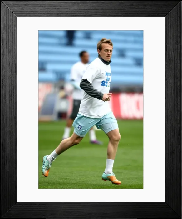 Framed Print : Sammy Clingan's Unique Pre-Match Routine: Coventry City vs. Peterborough United (Npower Championship, 07-04-2012, Ricoh Arena) - The Know the Score T-Shirt Warm-Up