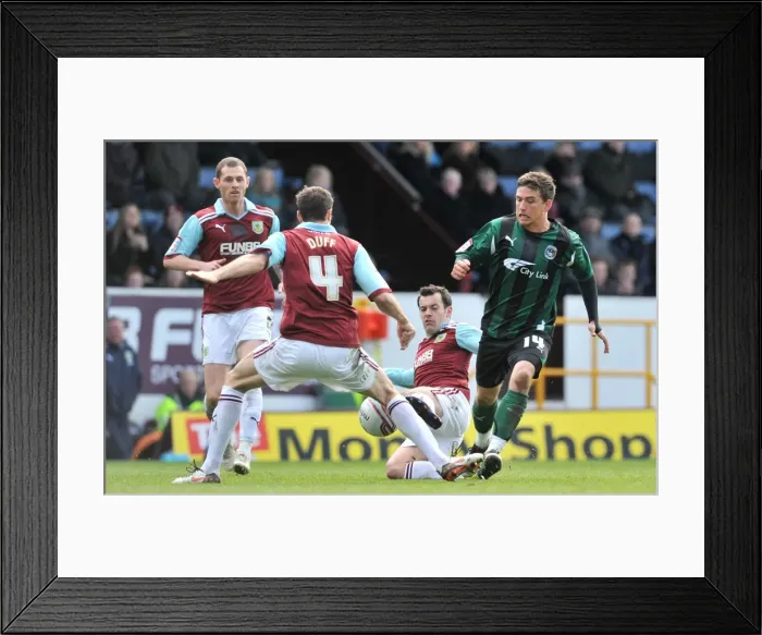 Framed Print : Cody McDonald's Fierce Battle Against Burnley's Defenders: Coventry City vs Burnley, Championship Clash at Turf Moor Framed Print : Cody McDonald's Fierce Battle Against Burnley's Defenders: Coventry City vs Burnley, Championship Clash at Turf Moor