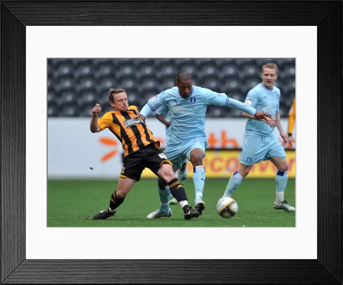 Framed Print : Battle for the Ball: McKenna vs. Platt in the Intense Npower Championship Clash (31-03-2012)