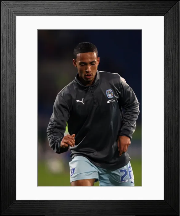 Framed Print : Jordan Clarke vs. Cardiff City: A Fierce Face-Off at Npower Championship (21-03-2012)