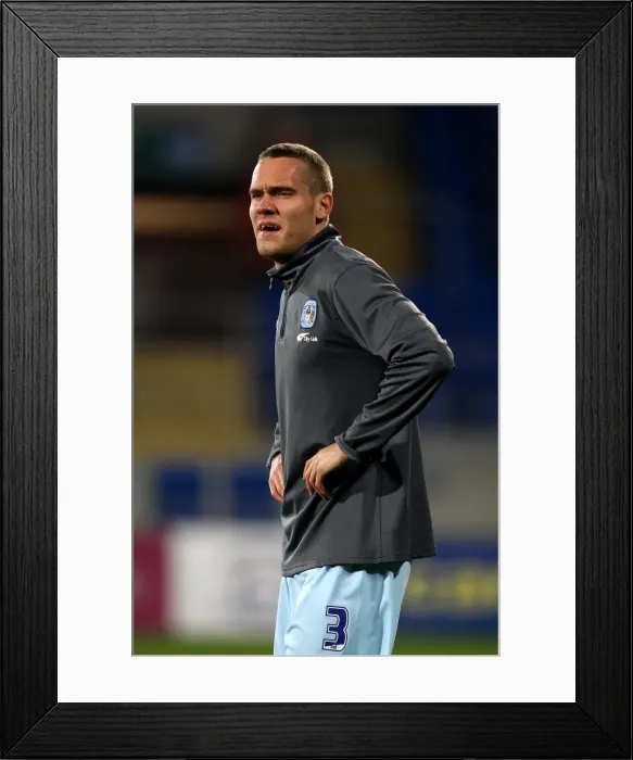 Framed Print : Chris Hussey Faces Off Against Cardiff City at Npower Championship Match (21-03-2012)