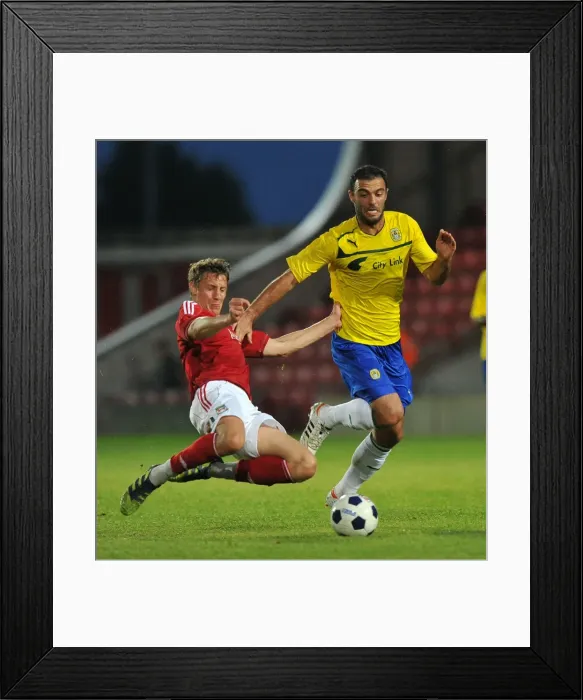 Framed Print : Pre-Season Clash: Bruno Constantin Tackled at Wrexham's Racecourse Ground Framed Print : Pre-Season Clash: Bruno Constantin Tackled at Wrexham's Racecourse Ground