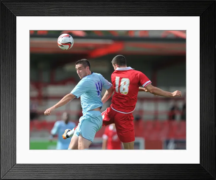 Framed Print : Coventry City's Callum Ball Soars Over Accrington Stanley's Tom Eckersley (Pre-Season Friendly) Framed Print : Coventry City's Callum Ball Soars Over Accrington Stanley's Tom Eckersley (Pre-Season Friendly)