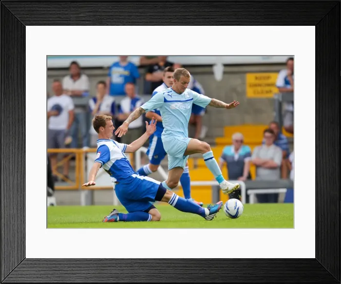 Framed Print : Clash of the Midfield Maestros: Seanan Clucas vs. Carl Baker at Memorial Ground Framed Print : Clash of the Midfield Maestros: Seanan Clucas vs. Carl Baker at Memorial Ground
