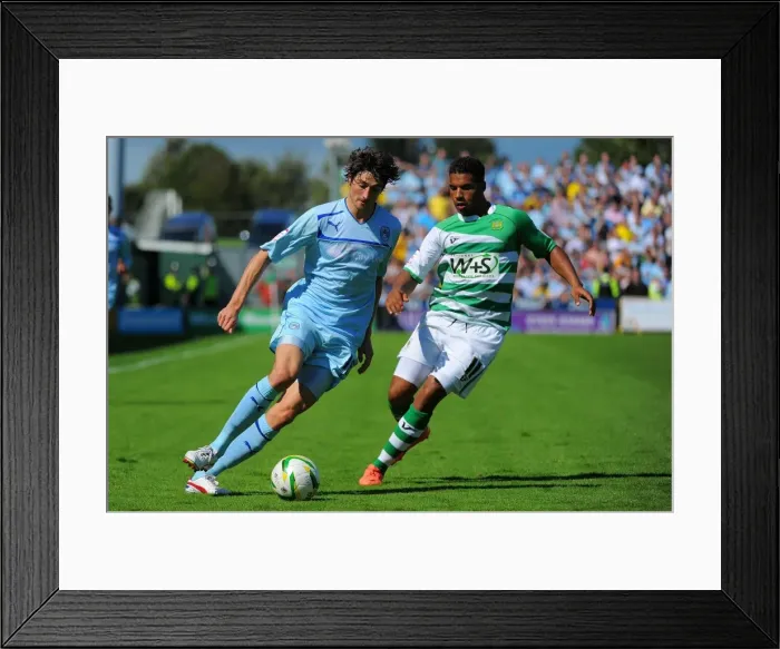 Framed Print : Coventry City vs Yeovil Town: Barton Outmaneuvers Reid in Npower League One Clash at Huish Park Framed Print : Coventry City vs Yeovil Town: Barton Outmaneuvers Reid in Npower League One Clash at Huish Park