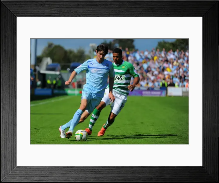 Framed Print : Adam Barton Outsmarts Reuben Reid: Coventry City vs. Yeovil Town in Npower League One Clash at Huish Park Framed Print : Adam Barton Outsmarts Reuben Reid: Coventry City vs. Yeovil Town in Npower League One Clash at Huish Park