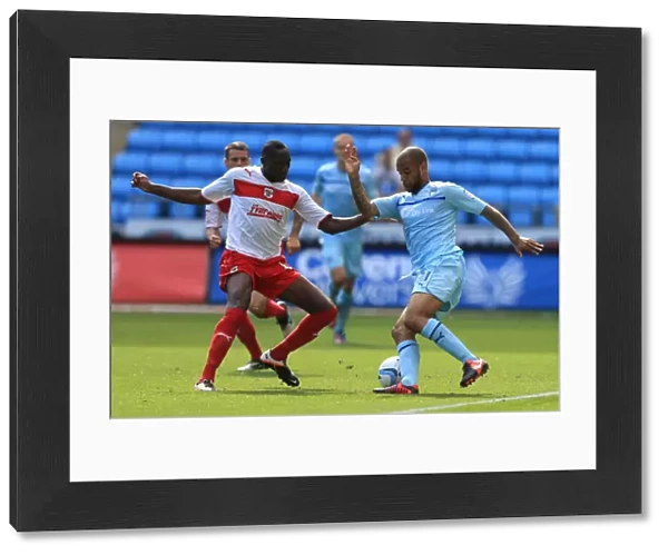 Action-Packed Rivalry: Lucas Akins vs. David McGoldrick at Ricoh Arena (Npower Football League One)