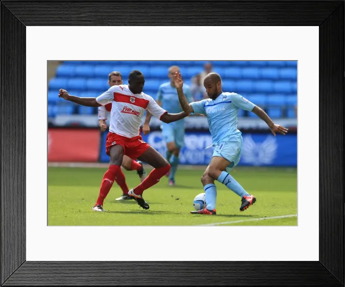 Framed Print : Action-Packed Rivalry: Lucas Akins vs. David McGoldrick at Ricoh Arena (Npower Football League One)