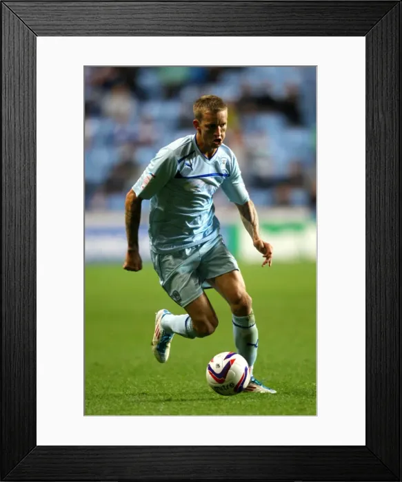 Framed Print : Carl Baker Fights Tenaciously in Coventry City's Capital One Cup Battle against Birmingham City at Ricoh Arena (28-08-2012)