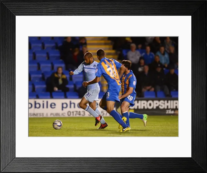 Framed Print : Chasing Down the Lead: McGoldrick Under Pressure from Wildig and Hector in Npower League One Showdown