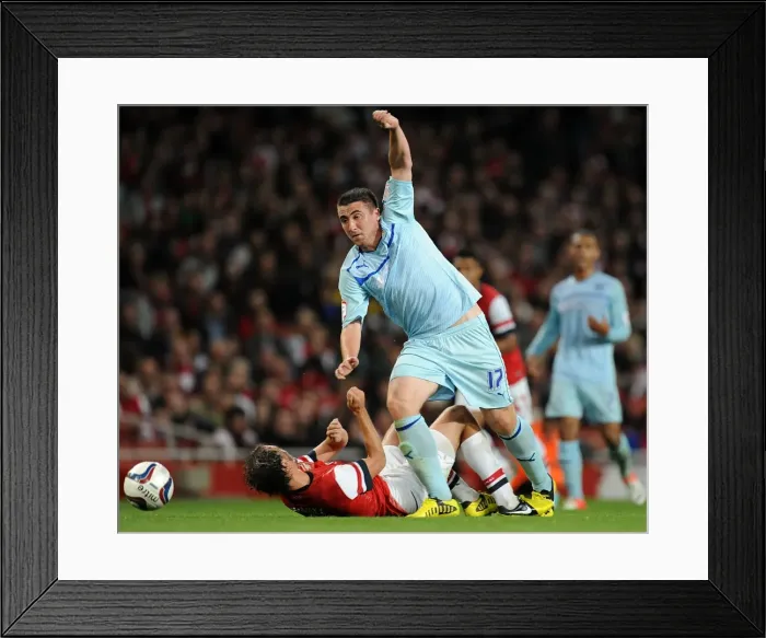 Framed Print : Callum Ball Dodges Ignasi Miquel in Coventry City's Capital One Cup Showdown at Arsenal's Emirates Stadium Framed Print : Callum Ball Dodges Ignasi Miquel in Coventry City's Capital One Cup Showdown at Arsenal's Emirates Stadium