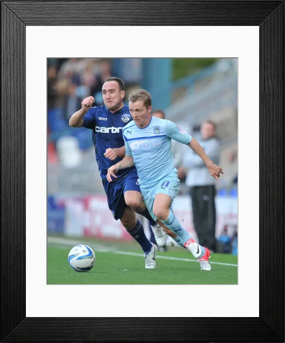 Framed Print : Battle for Ball Supremacy: McSheffrey vs Croft in Coventry City's Npower League One Clash at Oldham Athletic's Boundary Park Framed Print : Battle for Ball Supremacy: McSheffrey vs Croft in Coventry City's Npower League One Clash at Oldham Athletic's Boundary Park