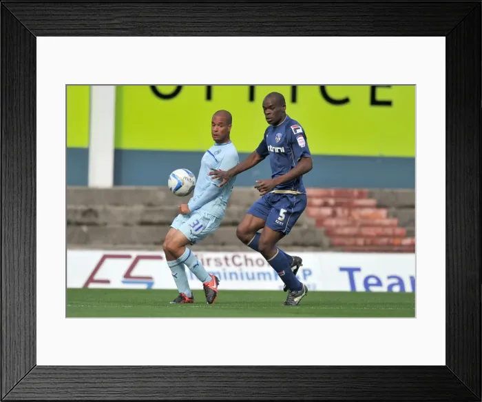 Framed Print : David McGoldrick vs. Jean Yves Mvoto Owono: A Fierce Battle for Possession in Coventry City's Npower League One Clash against Oldham Athletic (September 2012) Framed Print : David McGoldrick vs. Jean Yves Mvoto Owono: A Fierce Battle for Possession in Coventry City's Npower League One Clash against Oldham Athletic (September 2012)