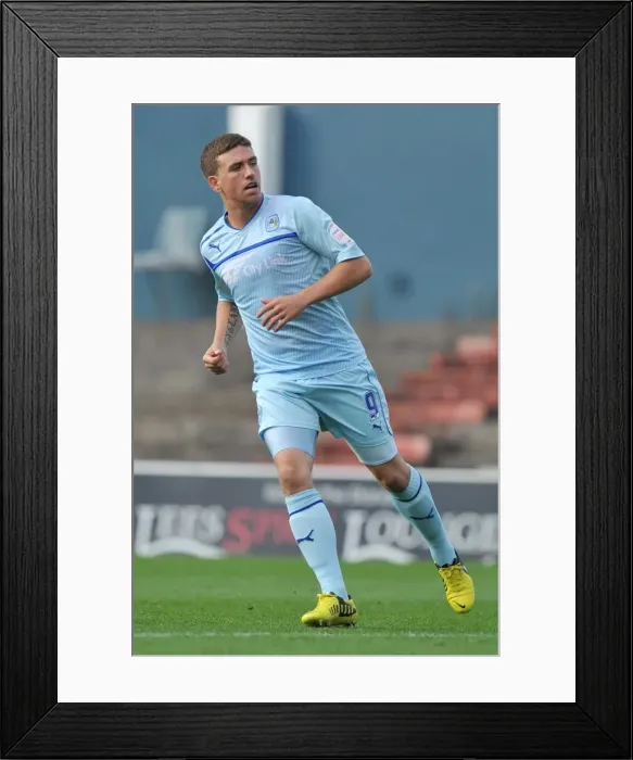 Framed Print : Determined Strike: Cody McDonald Scores for Coventry City Against Oldham Athletic in Football League One at Boundary Park Framed Print : Determined Strike: Cody McDonald Scores for Coventry City Against Oldham Athletic in Football League One at Boundary Park