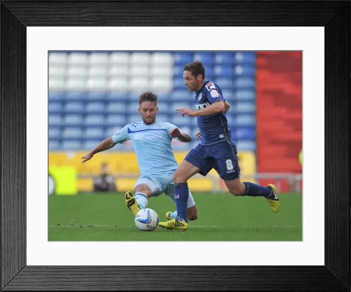 Framed Print : Battle for the Ball: James Bailey vs. Dean Furman - Coventry City vs. Oldham Athletic Framed Print : Battle for the Ball: James Bailey vs. Dean Furman - Coventry City vs. Oldham Athletic