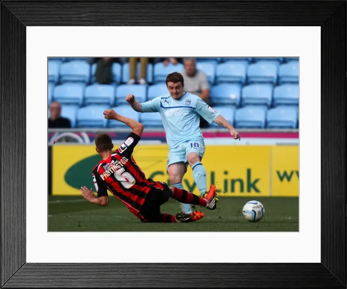 Framed Print : John Fleck vs Joe Partington: Intense Tackle in Coventry City vs Bournemouth Npower League One Match at Ricoh Arena Framed Print : John Fleck vs Joe Partington: Intense Tackle in Coventry City vs Bournemouth Npower League One Match at Ricoh Arena