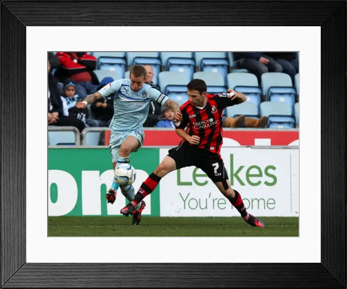 Framed Print : Battle for Possession: Coventry City vs Bournemouth in Football League One at Ricoh Arena