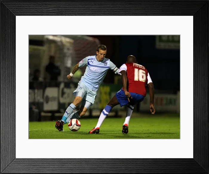 Framed Print : Intense Rivalry: Carl Baker vs Jamal Fyfield in the Johnstones Paint Trophy Northern Section Clash between Coventry City and York City Framed Print : Intense Rivalry: Carl Baker vs Jamal Fyfield in the Johnstones Paint Trophy Northern Section Clash between Coventry City and York City